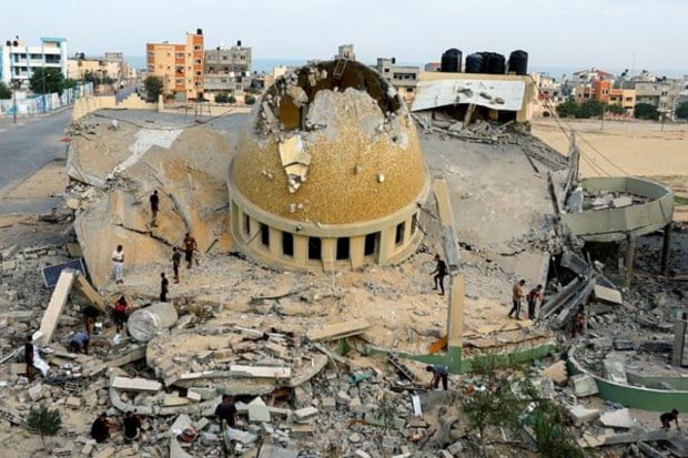 Palestinians inspect a mosque destroyed in Israeli strikes in Khan Younis in the southern Gaza Strip. (Image: Reuters)