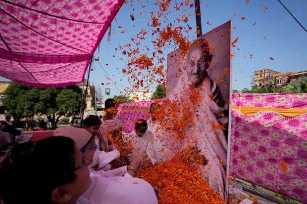 People pay homage to Mahatma Gandhi at Mubarak Mandi in Jammu. (AP News)