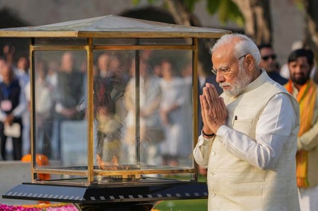 Prime Minister Narendra Modi pays homage to Mahatma Gandhi on the occasion of his birth anniversary, at Rajghat in New Delhi today. (PTI)
