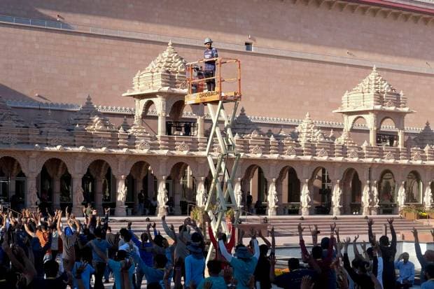 Worshippers practice a routine for the grand dedication ceremony of the BAPS Swaminarayan Akshardham. (AP Photo)