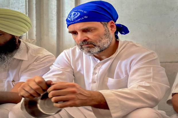 Congress leader Rahul Gandhi performs 'sewa' during a visit at the Golden Temple, in Amritsar. (PTI Photo)