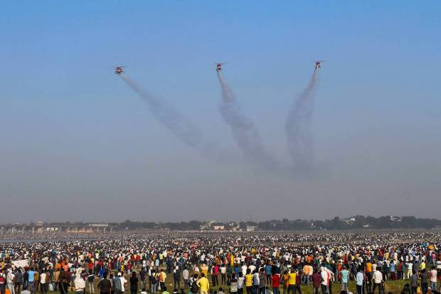 Helicopters of the Indian Air Force's aerobatic team 'Sarang' perform during the 91st Air Force Day celebrations, in Prayagraj (PTI Photo)