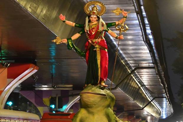 Devotees carry an idol of Goddess Durga idol to a pandal ahead of the Durga Puja festival, in Mumbai. (PTI Photo)