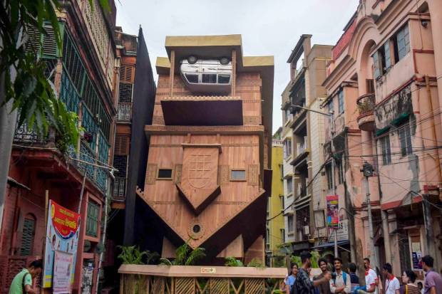 A community puja pandal themed on an 'Up side down' approach, in Kolkata. (PTI Photo)