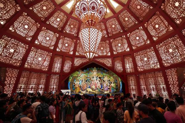 Devotees visit a community Durga Puja pandal in Kolkata. (PTI Photo)