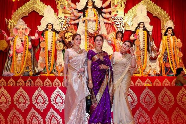 Actors Hema Malini, Rani Mukerji and Esha Deol pose for photos at a pandal of North Bombay Sarbojanin Durga Puja, in Mumbai. (PTI Photo) 