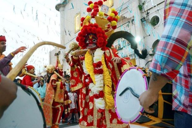 Artists at a religious procession during the Navratri celebrations in Amritsar. (PTI Photo)