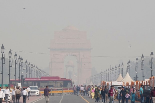 A thick blanket of smog covers the India Gate in New Delhi on Monday. (PTI Photo)