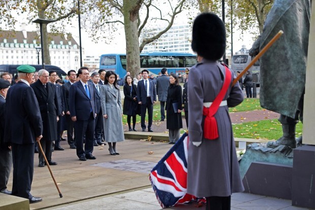 President of South Korea Yoon Suk Yeol, First lady Kim Keon Hee, and Prince Richard, Duke of Gloucester attend a wreath laying ceremony at the Korean War Memorial in London. (Reuters Photo)