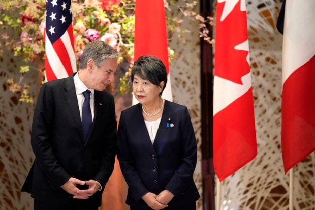U.S. Secretary of State Antony Blinken, left, and Japan's Foreign Minister Yoko Kamikawa, speak as they wait for a group photo session during the Group of 7 Foreign Ministers meetings at the Iikura Guest House.(AP Photo)