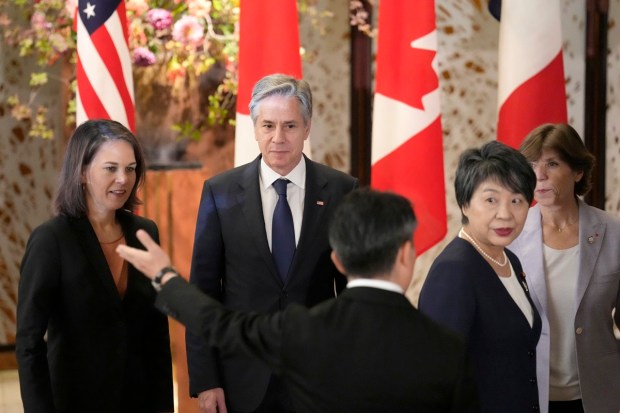 From left, Germany's Foreign Minister Annalena Baerbock, U.S. Secretary of State Antony Blinken, Japan's Foreign Minister Yoko Kamikawa, France's Foreign Minister Catherine Colonna, are escorted by a staff member after a group photo session during the Group of 7 Foreign Ministers meetings at the Iikura Guest House Wednesday.(AP Photo)