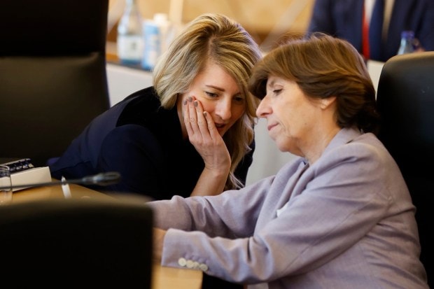 Canadian Minister of Foreign Affairs Melanie Joly, left, and French Foreign Minister Catherine Colonna interact during a session of the Group of 7 Foreign Ministers meetings in Tokyo.(AP Photo)