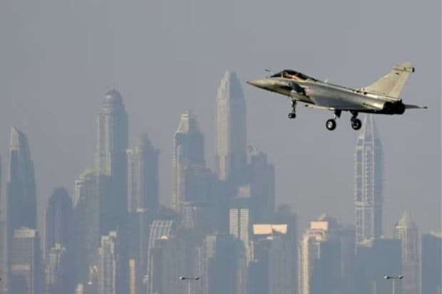 The skyline of the city is seen on the background as a French Air Force Dassault Rafale C jet fighter prepares to land during the opening day of the Dubai Air Show, Monday.(AP)