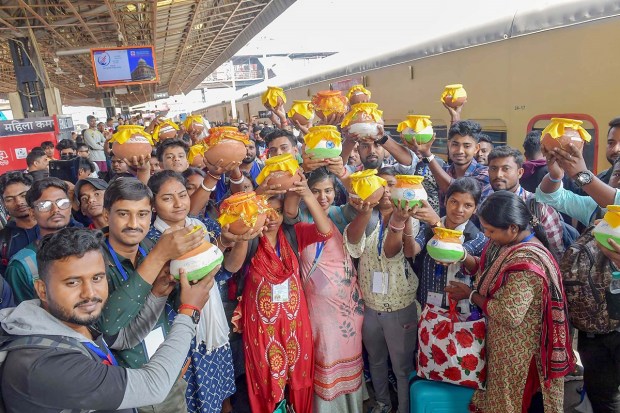 'Amrit Kalash Yatra' delegation from West Bengal under the 'Meri Maati Mera Desh' campaign arrives at New Delhi Railway Station. (PTI Photo)