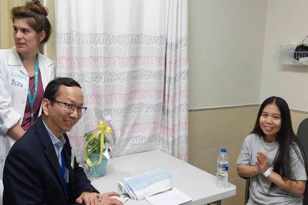 This photo provided by Thailand's Foreign Ministry shows a woman, right, one of freed Thai hostages, at the Shamir Medical Center in Israel. (Thailand's Foreign Ministry via AP )