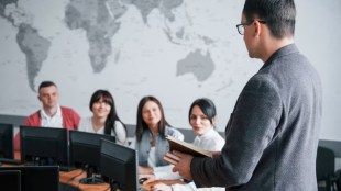 How do business schools prepare students for a globalised business environment?