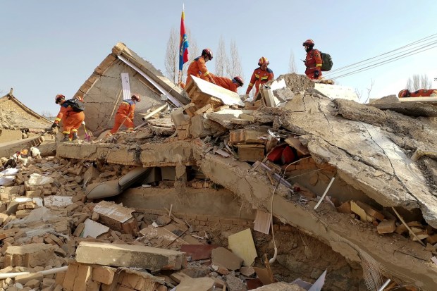 Rescue workers searched for survivors in collapsed buildings and at least one landslide site. They also issued an appeal for more workers to join the operation. (AP)