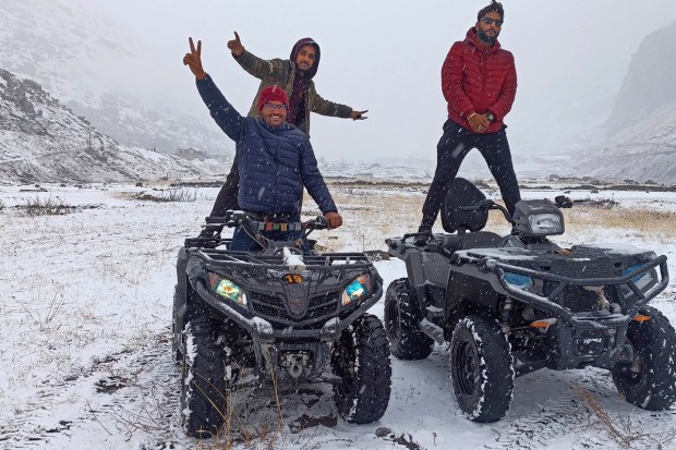 Lahaul & Spiti: Tourists ride all-terrain vehicles (ATV) after fresh snowfall at Koksar, in Lahaul & Spiti district. (PTI Photo)