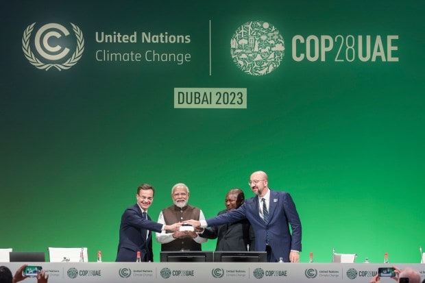 He launches the Green Credit Initiative, a market-based mechanism to reward voluntary environmental actions and create carbon sinks through people's participation. Modi co-launches LeadIT 2.0, an initiative with Sweden to co-develop and transfer low-carbon technology and offer financial support for industry transition in developing nations. (PTI photo)