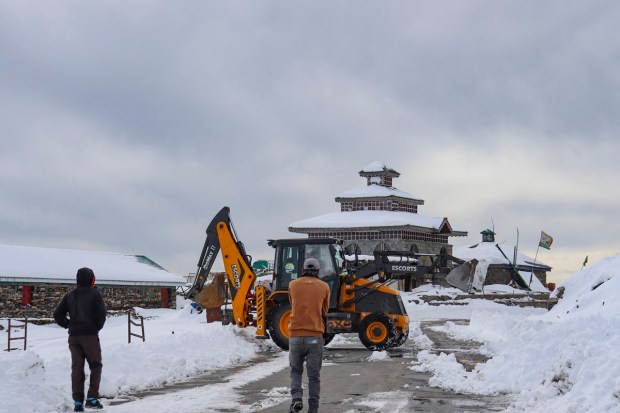 Poonch: Snow being cleared from Mughal Road after snowfall, in Jammu & Kashmir. The road was re-opened for traffic on Sunday after remaining closed for three days. (PTI Photo)