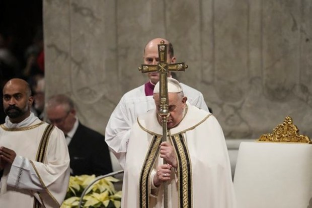 Pope Francis holds the pastoral staff as he presides over Christmas eve Mass, at St. Peter's Basilica at the Vatican. (AP)