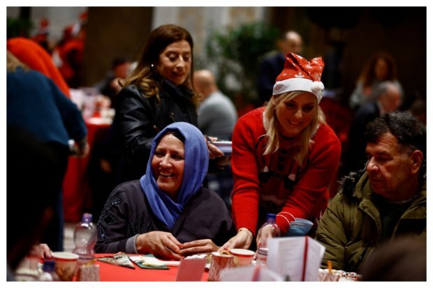 Emotional reactions unfold during the traditional Christmas lunch for the needy and poor organized by Christian charity Community of Sant'Egidio in the Basilica of Santa Maria in Trastevere, Rome, Italy, on December 25, 2023. (Image: Reuters)