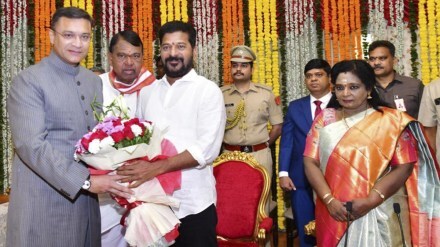 Telangana Chief Minister Revanth Reddy felicitates the newly sworn-in Pro-tem Speaker of the Legislative Assembly Akbaruddin Owaisi at the Raj Bhavan, in Hyderabad, Saturday, Dec. 9, 2023. Telangana Governor Tamilisai Soundararajan is also seen. (PTI Photo)