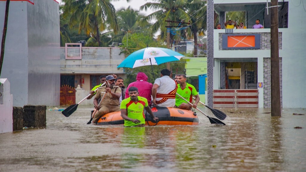 People trapped in floodwater being shifted by rescue officials to a safer place as heavy rains continue, in Kanyakumari district, Sunday, Dec. 17, 2023. (PTI Photo) 