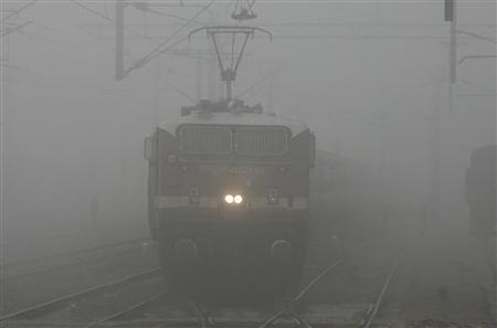 A passenger train moves through heavy fog in the northern Indian city of Chandigarh (Image/Reuters)