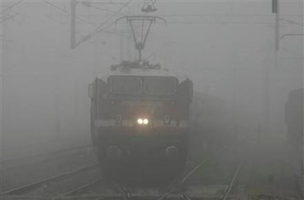 A passenger train moves through heavy fog in the northern Indian city of Chandigarh (Image/Reuters)