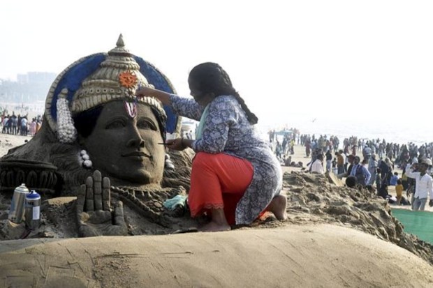 Sand artist Laxmi Gaud makes a sand sculpture of Lord Ram ahead of the consecration ceremony of Ayodhya Ram Temple, at Juhu Beach in Mumbai, on January 20.