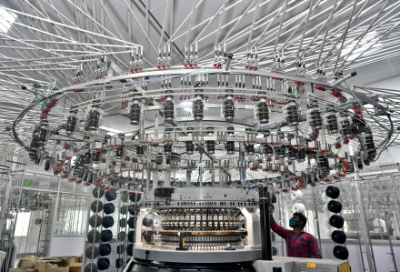 A worker operates a knitting machine at a textile factory of Texport Industries in Hindupur town in Andhra Pradesh (Image/Reuters) A worker operates a knitting machine at a textile factory of Texport Industries in Hindupur town in Andhra Pradesh (Image/Reuters)