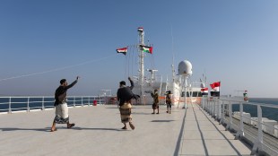 People dance on the deck of the Galaxy Leader commercial ship, seized by Yemen's Houthis last month, off the coast of al-Salif, Yemen (Image/Reuters)