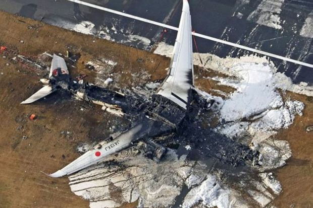 An aerial view shows burnt Japan Airlines' (JAL) Airbus A350 plane after a collision with a Japan Coast Guard aircraft at Haneda International Airport in Tokyo, Japan January 3, 2024, in this photo taken by Kyodo. (Photo: Reuters)