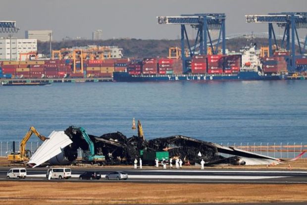Two excavators equipped with cutting equipment ripped off the Airbus A350's wing, while another lifted debris from inside the burnt out cabin into a large lorry as around a dozen personnel in white overalls and hard hats watched on. (Photo: Reuters)