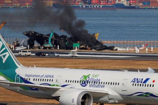 Smoke rises from the burnt Japan Airlines (JAL) Airbus A350 plane as officials remove its wreckage after a collision with a Japan Coast Guard aircraft at Haneda International Airport in Tokyo, Japan January 5, 2024. (Photo: Reuters)