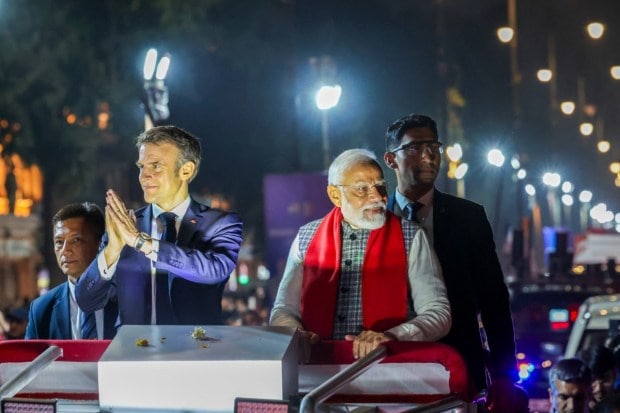 Prime Minister Narendra Modi and French President Emmanuel Macron during Shobha Yatra in Jaipur on January 25. (Image: PTI)