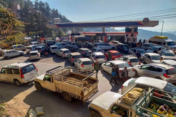 Heavy rush at a petrol pump following the nationwide strike of truck drivers against a provision in the new penal law on hit-and-run accident cases, in Shimla. (PTI Photo)