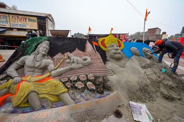 A sand artist sculpts a model, ahead of the consecration ceremony of Ram Mandir, in Ayodhya, Saturday, Jan. 20, 2024. (PTI Photo/Vijay Verma)