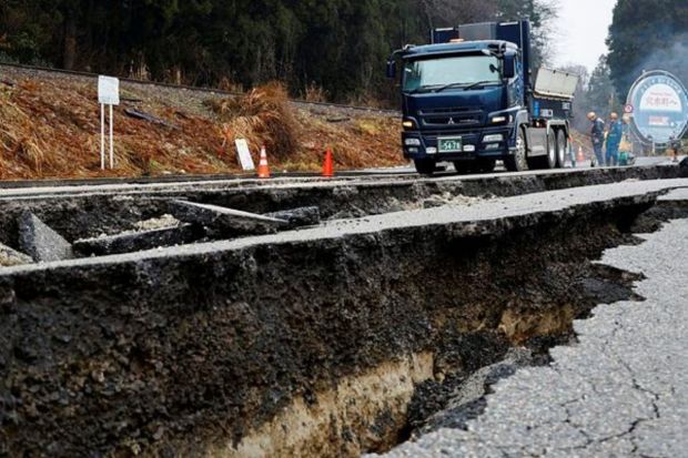 Workers repair a damaged road, in the aftermath of an earthquake, near Anamizu, Japan, January 3, 2024. (Photo: Reuters)