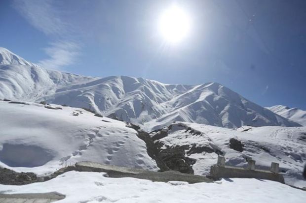 Against the picturesque backdrop of the Pir Panjal Range, vehicles gracefully traverse the Mughal road in Shopian district following the most recent snowfall in 2023. The pristine white landscape, adorned with a fresh layer of snow, transforms the journey along this scenic route into a captivating experience. (Express photo by Shuaib Masoodi)