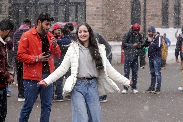 Tourists enjoy fresh spells of snowfall in Shimla, Himachal Pradesh (PTI Photo)
