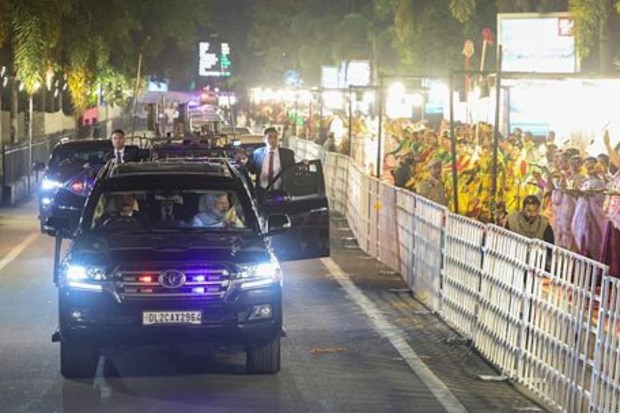 PM Modi greets people standing to welcome him on his arrival. (Image: PTI)