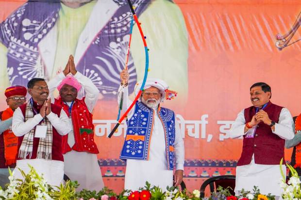 Prime Minister Narendra Modi with Tribal Affairs Minister Arjun Munda, Madhya Pradesh Chief Minister Mohan Yadav and others during the 'Janjatiya Sammelan' in Jhabua, Madhya Pradesh. (PTI Photo)