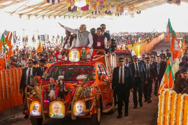 Prime Minister Narendra Modi with Union Tribal Affairs Minister Arjun Munda and Madhya Pradesh Chief Minister Mohan Yadav at a roadshow during 'Janjatiya Sammelan' in Jhabua, Madhya Pradesh. (PTI Photo)