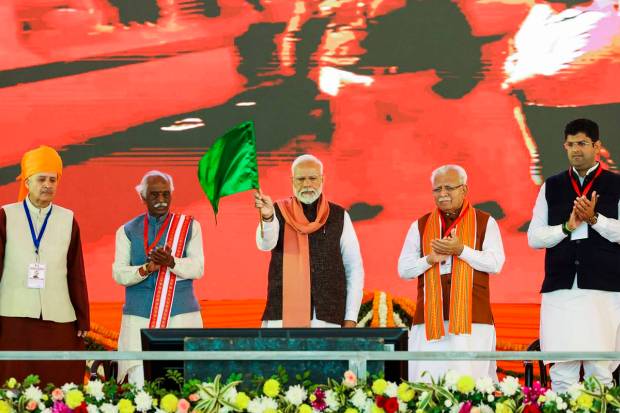 Prime Minister Narendra Modi with Haryana Governor Bandaru Dattatreya, the Chief Minister Manohar Lal and others during the foundation stone laying ceremony of an All India Institute of Medical Sciences (AIIMS) and other development projects, in Rewari district. (PTI Photo)