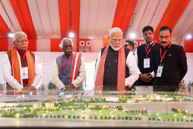 Prime Minister Narendra Modi with Haryana Governor Bandaru Dattatreya, Chief Minister Manohar Lal and others visits an exhibition of various development projects, in Rewari district. (PTI Photo)