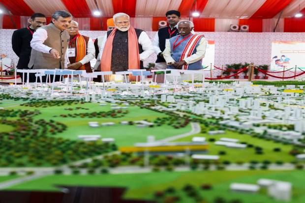 Prime Minister Narendra Modi with Haryana Governor Bandaru Dattatreya, Chief Minister Manohar Lal and others visits an exhibition of various development projects, in Rewari district. (PTI Photo)