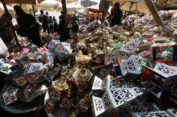 People look at traditional decorative Ramadan lanterns called 