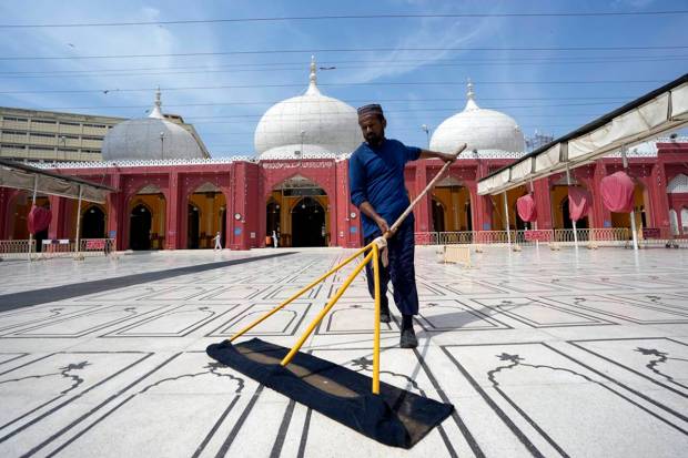 A Pakistani man cleans a mosque in preparation for the upcoming Muslim fasting month of Ramadan, in Karachi, Pakistan. AP/PTI